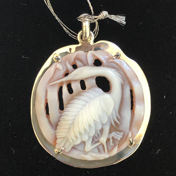 Heron with grass, 25mm, shell cameo pendant, handcrafted in our latticework carving style and set in 950 silver. Artist signed on reverse, hallmark stamped, registry number #2601. Comes with an 18" rhodium plated, sterling silver chain. Sold with a Certificate of Authenticity. Eco-friendly, Fair trade. One-off.  Perfect gift for any other special occasion. There is really nothing more special than knowing you have the only one.