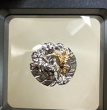 Hummingbird w/ hibiscus flower pendant, 25 mm, rhodium plated, .925 sterling silver with 18Kt gold plating accenting the hummingbird. Sold with a 18” rhodium plated sterling silver chain.  Authorized reproduction of an original museum quality Rainforest Design®️handcrafted shell cameo, carved in Panama by a master Wounaan Indian artist. Part of the proceeds go to the artist whose signature appears on the reverse. 