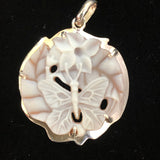 Blue butterfly w/flower 24mm shell camel pendant, handcrafted in our latticework style and set in 950 silver. Registry number #2913, this is a unique, one of a kind carved piece. Artist signed on the reverse. Hallmark on reverse. Comes with an 18” rhodium plated sterling silver chain. Sold with a Certificate of Authenticity, eso- friendly, fair trade. 