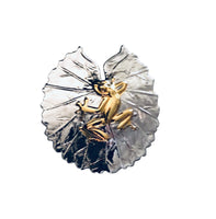 Frog on lily pad pendant, 30mm, rhodium plated, .925 sterling silver, 18Kt gold plating on frog. Sold with an 18” sterling silver chain. Authorized reproduction of an original museum quality Rainforest Design®️handcrafted shell cameo, carved in Panama by a master Wounaan Indian artist. Part of the proceeds go to the artist whose signature appears on the reverse. The Panama Golden Frog or Rana Dorada, is now extinct in the wild,